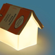 Illustration for article titled Turn Your Book into This Lamp's Roof (And Save Your Spot)